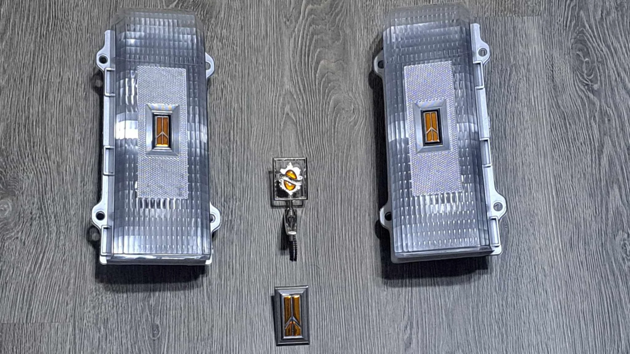 1986 to 1988 Cutlass Clear Tail Light Set with gold emblems and ornaments